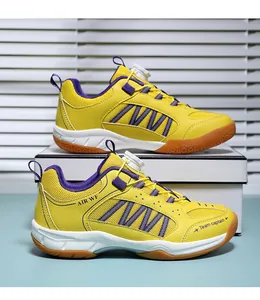 Yellow kids professional badminton shoes with rotary dial lacing and breathable mesh design