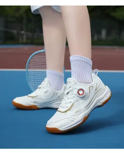 Close-up of professional children's breathable white badminton shoes on a sports court
