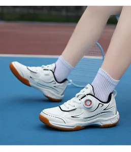 Close-up detail of children's breathable badminton sports shoes featuring a rotary buckle
