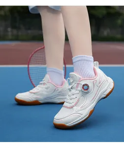 Professional detail view of breathable children's badminton shoes with rotary buckle laces.