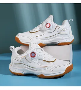 Detail of white children's badminton shoes with breathable mesh and dial laces