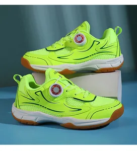 Close-up of lime green children's badminton shoes with rotating buckle system