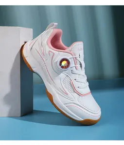 Side view of professional white and pink breathable mesh children's badminton shoes