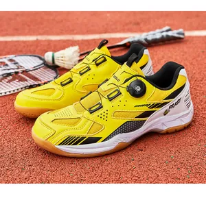 Detail view of yellow professional badminton shoes with breathable mesh and dial system