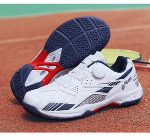Professional white badminton shoes featuring dial lacing system and honeycomb sole