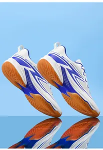 Detail of breathable white and blue sports shoes showing the non-slip rubber outsole