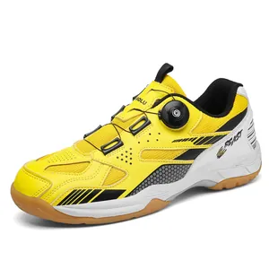 Professional yellow and white athletic badminton shoes with a modern rotary buckle