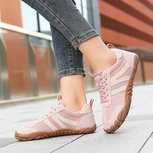 Breathable pink German Army Trainer sneakers with vintage mesh upper and gum rubber sole.