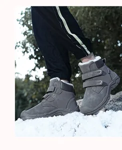Warm grey children's high-top winter snow boots with thick fur lining shown in snow