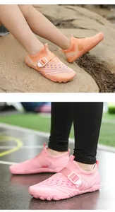Close-up of children's breathable mesh water shoes in pink and orange colors