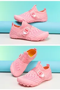 Detailed view of pink breathable kids' water shoes with white adjustable buckles for beach