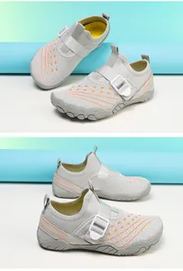 Side and top view of breathable mesh water shoes for kids featuring orange accents and strap
