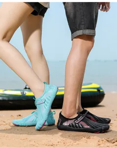 Couple wearing quick-dry water shoes for beach and outdoor river trekking activities
