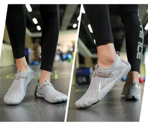 Lightweight grey wading shoes for beach and outdoor water sports shown on model