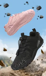Dynamic detail showing pink and black children's barefoot sports shoes for fitness.