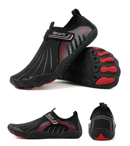 Detail view of black and red outdoor wading shoes with non-slip rubber soles.