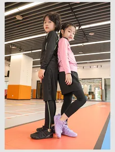 Asian children wearing breathable purple and black indoor gym shoes in a sports center.