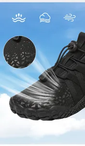 Detailed view of breathable mesh upper and quick-lace system on black kids sports shoe