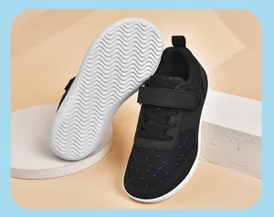 Detailed view of children's wide-toe sports shoes featuring wave-patterned non-slip sole.