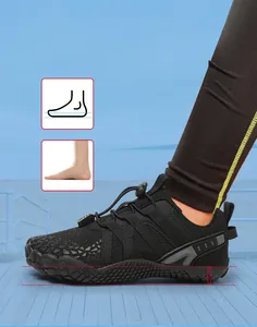 Close-up of black kids sports shoes showing shock-absorbing soft sole and arch support