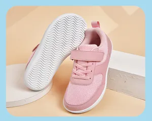Detailed shot of pink children's sneakers with non-slip sole and hook-and-loop straps