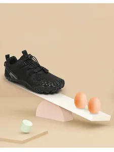 Detail of lightweight kids barefoot sports shoe balanced with eggs on a creative lever