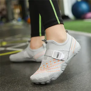 Breathable kids water shoes with grey mesh and orange accents for beach activities.