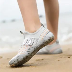 Breathable kids beach water shoes in gray with orange accents for outdoor wading activities.