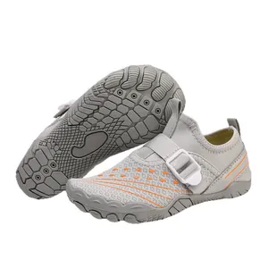 Grey children's breathable water shoes with orange accents and anti-slip rubber sole