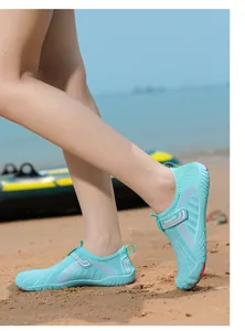 Close-up of mint green outdoor water shoes for beach activities and water sports