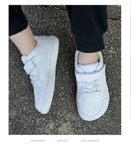 White mesh children's sneakers featuring a wide toe box and easy velcro straps for autumn