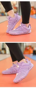 Detailed view of purple minimalist sports shoes with barefoot-style rubber sole.