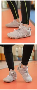 Detail view of flexible grey children's barefoot shoes for indoor sports and gym.