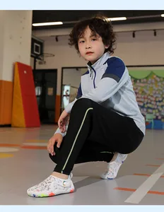 Child wearing patterned quick-dry water shoes in an indoor sports gym environment