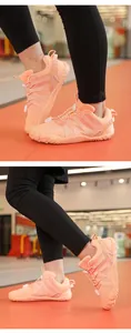 Detail of orange children's barefoot fitness shoes with anti-slip rubber soles