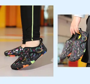 Detailed close-up of kids quick-dry water shoes featuring colorful graffiti prints
