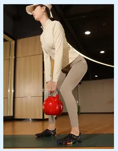 Asian woman wearing colorful patterned quick-dry water shoes while training in a gym
