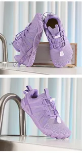 Detailed macro view of purple children's five-finger sports shoes with elastic laces