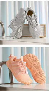 Detailed view of kids barefoot shoes showing traction sole and elastic toggle laces