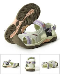 Detail view of women's cream outdoor sandals with purple mesh and secure straps