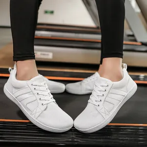 White wide toe box barefoot training shoes for fitness and gym workout macro view