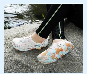 Close-up of non-slip quick-dry barefoot water shoes with colorful patterns on a rock surface