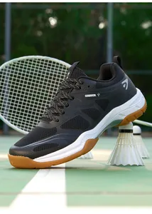 Chaussures de badminton professionnelles noires avec semelle en gomme antidérapante.