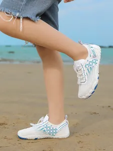 Breathable white kids water shoes for beach and swimming with non-slip rubber sole.