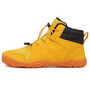 Side profile view of yellow high-top snow boots with warm black fleece lining