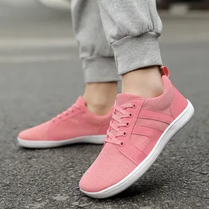 Close-up of pink lightweight barefoot training shoes with breathable mesh upper