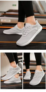 Detailed view of grey breathable barefoot shoes with wide toe box for fitness
