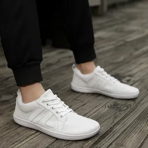 Detail view of men's lightweight white barefoot fitness shoes with a wide toe box design