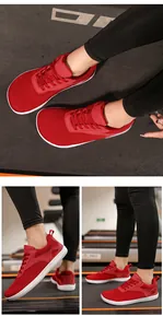 Red breathable wide toe barefoot running shoes shown in action on a gym treadmill