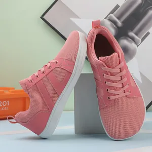 Close-up of pink lightweight barefoot training shoes with breathable mesh upper and wide toe